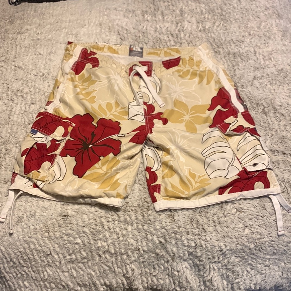Nice board shorts/swim suit.